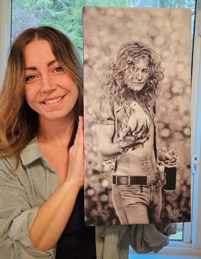 arist amber bahm holding her realism portrait painting of robert plant from led zeppelin